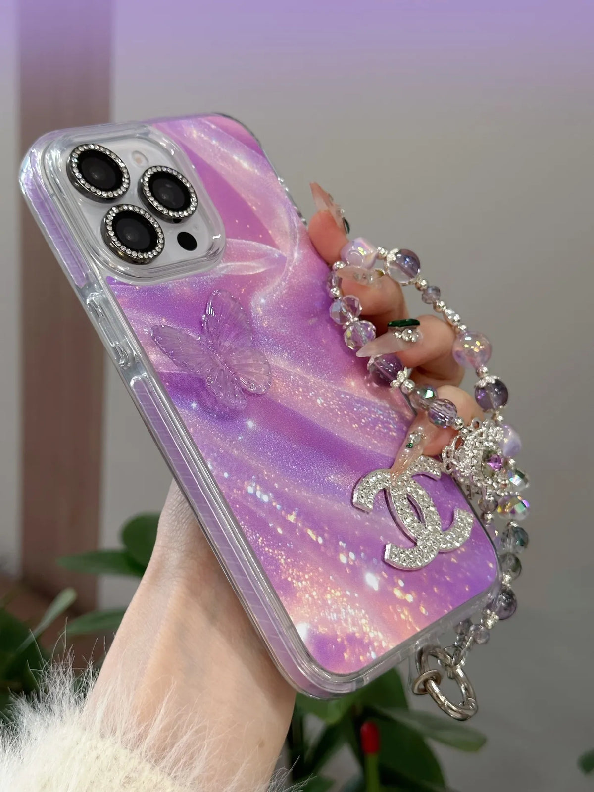 Louis Vuitton-inspired marbled phone case with chain charm