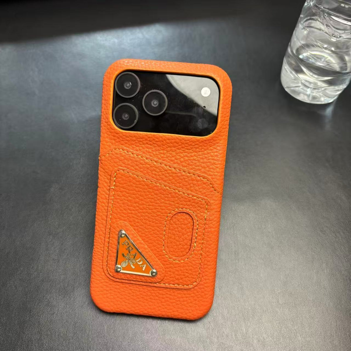 Prada-inspired pastel iPhone 17 Pro case with triangle detail