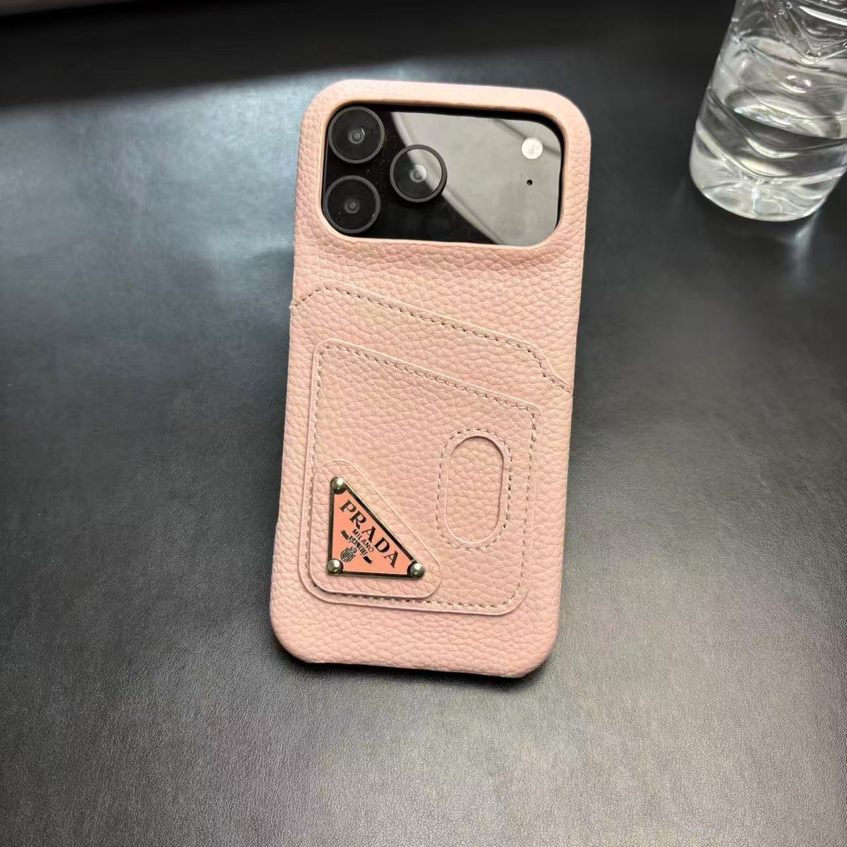 Prada-inspired pastel iPhone 17 Pro case with triangle detail