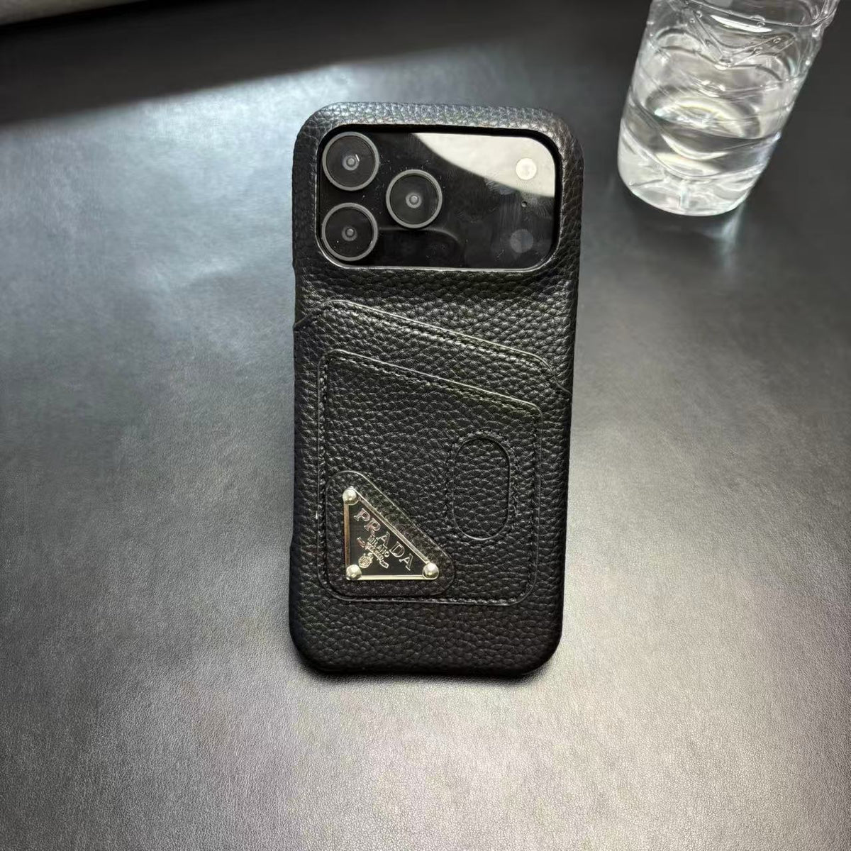 Prada-inspired pastel iPhone 17 Pro case with triangle detail