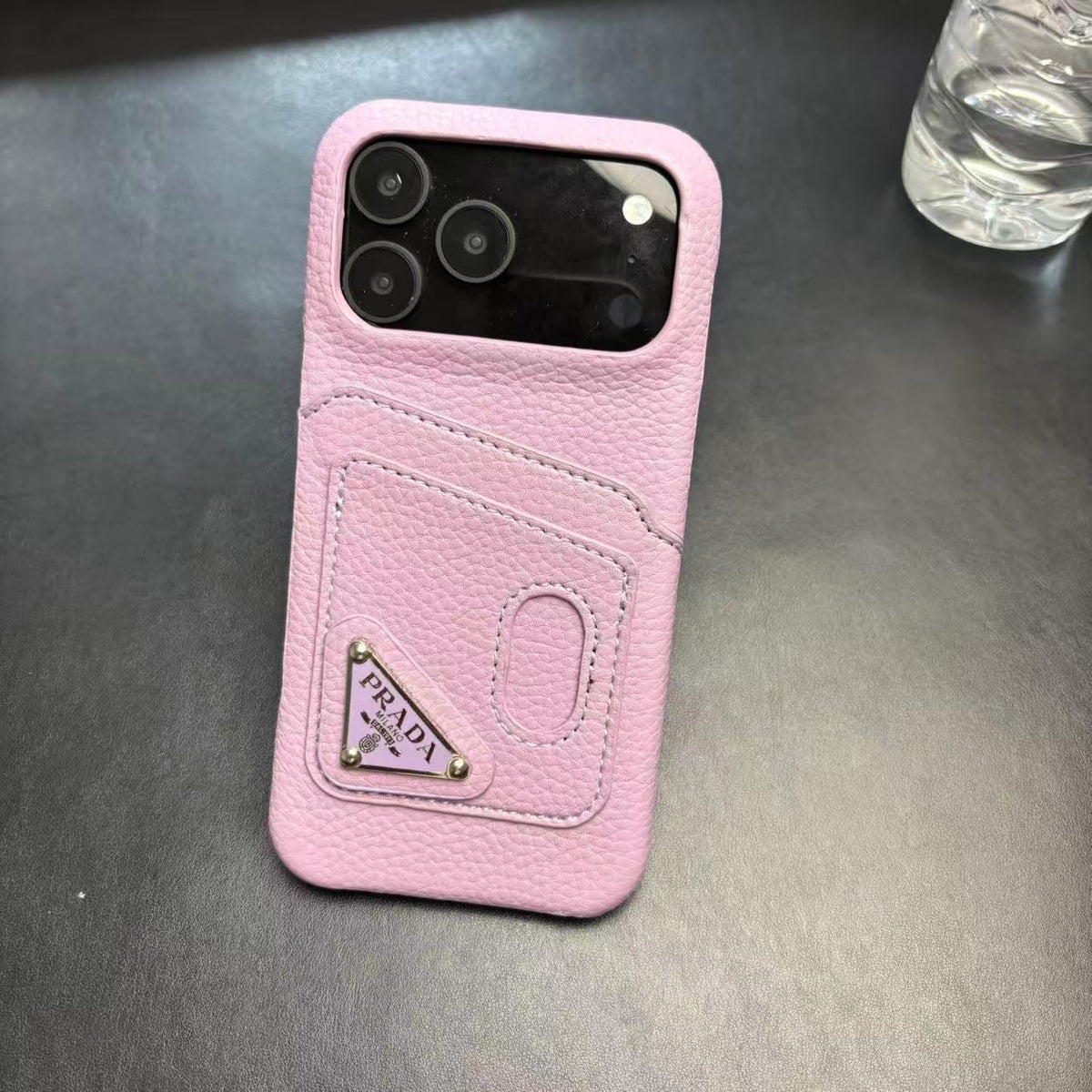 Prada-inspired pastel iPhone 17 Pro case with triangle detail