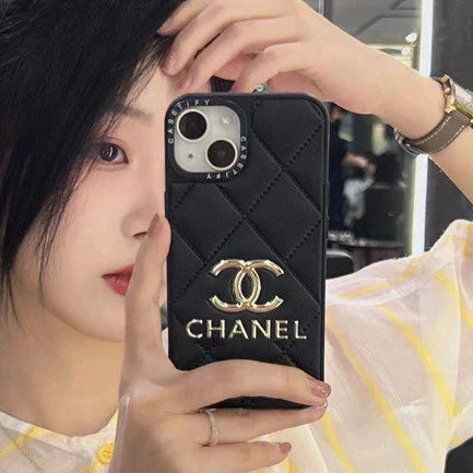 Chanel-inspired geometric iPhone case with metal emblem